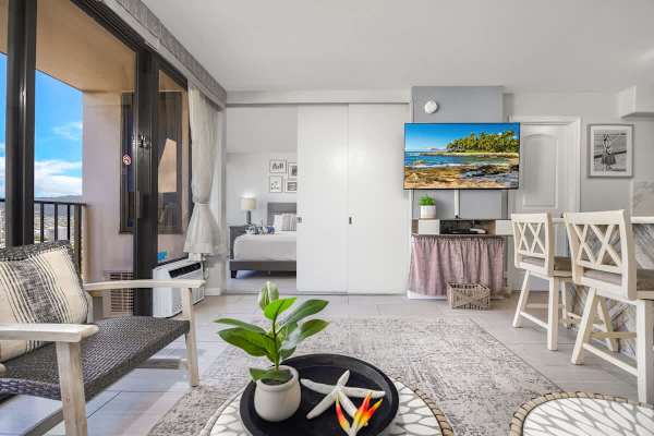 The living room and bedroom are separated by a sliding door.