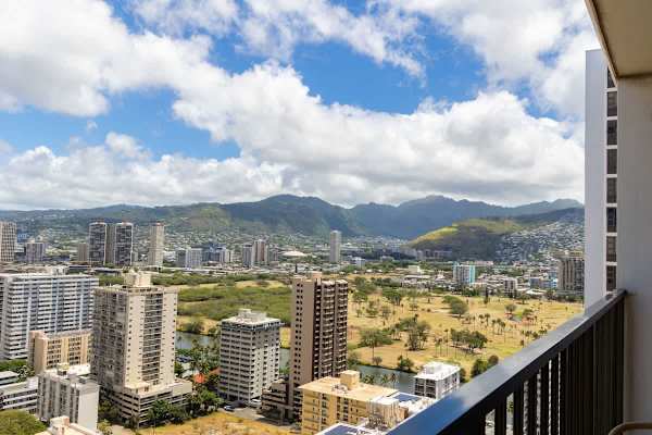 Enjoy expansive views of the lush mountains and vibrant cityscape right from your private balcony.