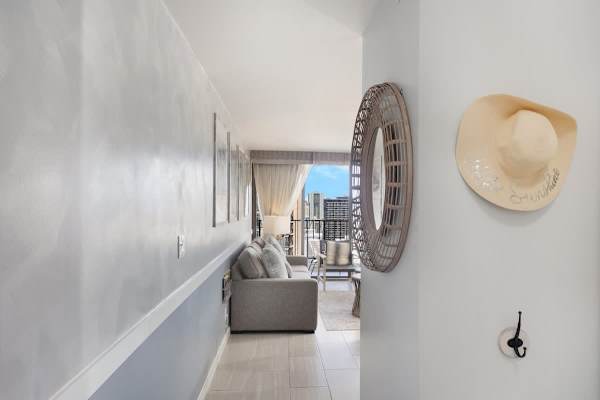 Step into a bright and inviting space that opens up to a comfortable living area and a balcony with captivating views.