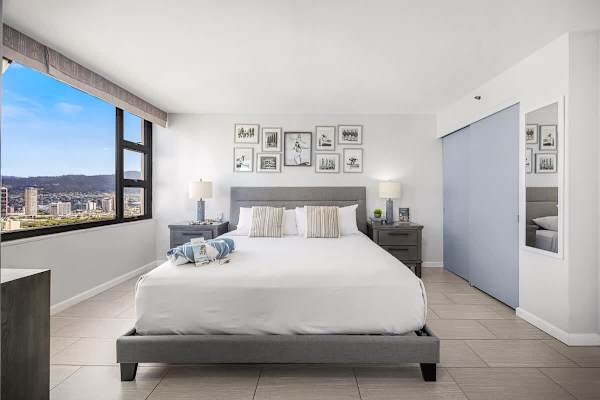 Retreat to your spacious and stylish bedroom, offering ultimate comfort and captivating city views.