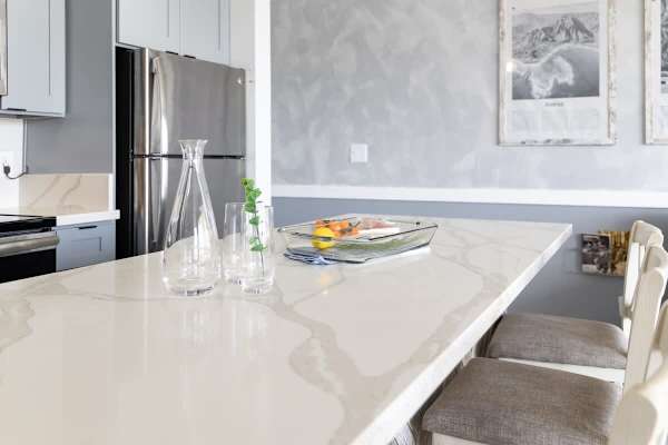 Enjoy casual dining and meal prep on this spacious and elegant kitchen island with comfortable bar seating.