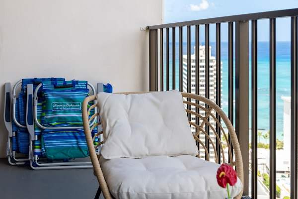 Step onto your private balcony and soak in the fresh air with comfortable seating and beach essentials at hand.