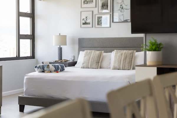 Relax in this bright and inviting bedroom featuring a king-size bed and stylish decor to enhance your island escape.
