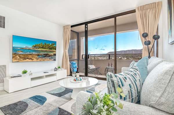 Settle into the chic living room and enjoy your favorite entertainment on the 65" smart TV, all while being just steps away from your private balcony with breathtaking views.