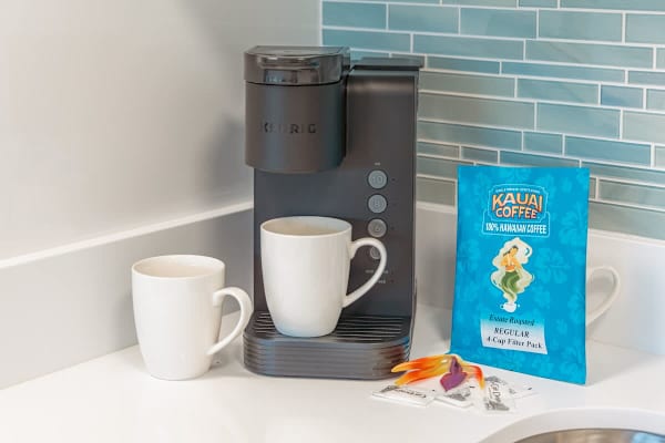 Start your day right with a fresh brew from the convenient Keurig coffee maker, complemented by our complimentary coffee, ensuring a taste of paradise with every cup