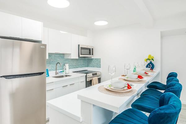 Whip up delicious meals in your fully equipped, modern kitchen, featuring a stylish breakfast bar and all the essentials for a comfortable stay.