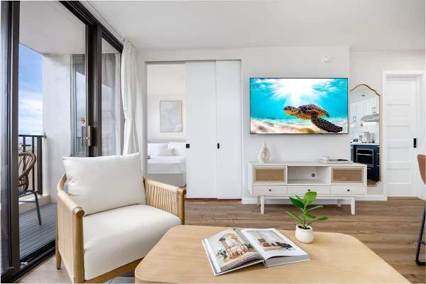 The bedroom and living area are separated by a sliding door.