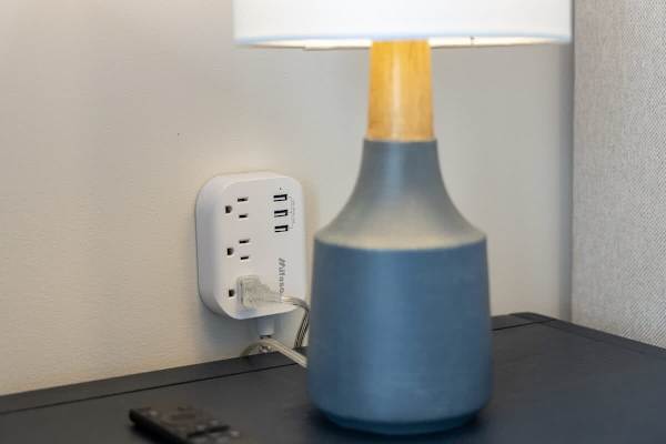 Stay charged and connected with a convenient wall outlet featuring multiple power and USB ports, perfect for all your devices.