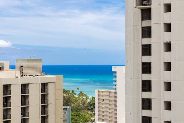 Savor stunning partial ocean views framed by surrounding cityscapes and lush greenery.