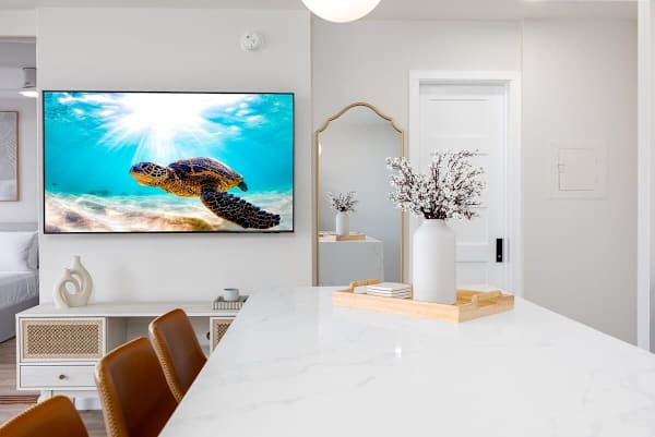 Enjoy entertainment on your 65" smart TV while having your meal.