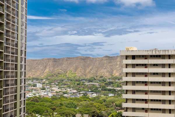Enjoy the distant view of Diamond Head mountain, the vibrant city, and the lush greenery from the balcony.