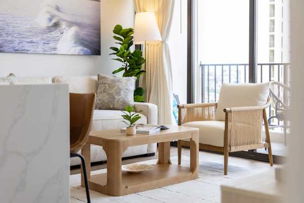 Enjoy a moment of relaxation in this inviting living space, complete with a stylish coffee table.