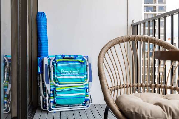 Relax and enjoy the outdoors on your private balcony, complete with two Tommy Bahama beach chairs ready for your beach adventure.
