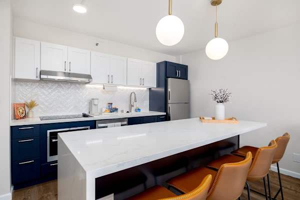 Step into this sleek and modern kitchen, boasting a spacious island with 4 ample seating, perfect for casual dining or entertaining.