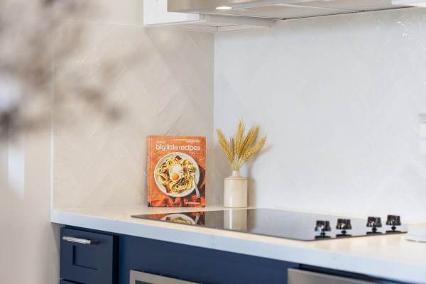Unleash your inner chef by preparing your meals in this modern kitchen.