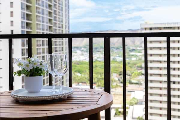 Enjoy a refreshing drink with a view from this charming balcony, complete with a small table and 2 chairs.