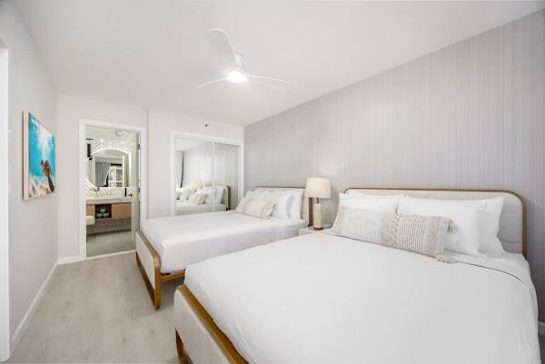 Unwind in this stylish bedroom, which features 2 cozy queen beds and direct access to a beautifully appointed bathroom.