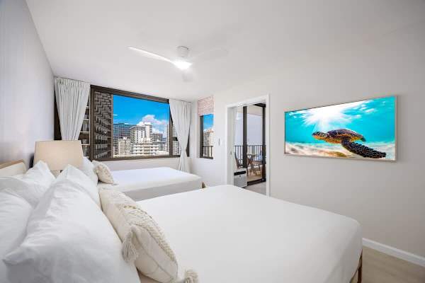 Rest and recharge in our cozy bedroom, offering two queen-size beds and a 55" smart TV with cable for your entertainment.