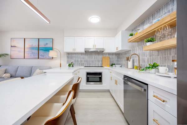 Step into our fully equipped kitchen with a Thermomate microwave/oven combo, a refrigerator, and a dishwasher, ensuring every culinary need is met.