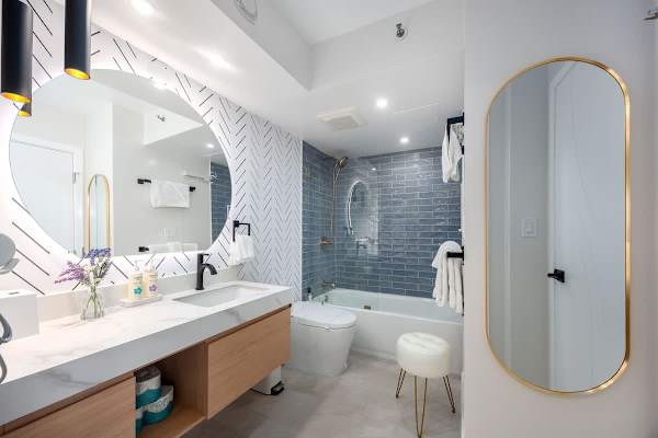 Indulge in a spa-like experience in this modern bathroom, complete with a beautiful shower and bathtub for ultimate relaxation.