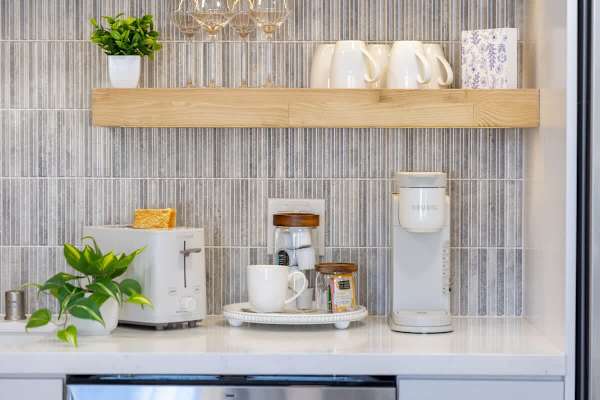 Start your morning right with a fresh cup of coffee from the Keurig coffee maker, or enjoy a slice of toast from the Cuisinart toaster, all provided for your convenience.