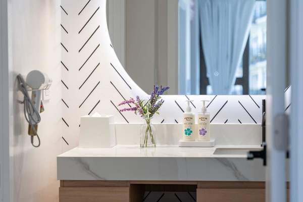 Step into this beautifully designed bathroom with a modern vanity.