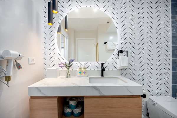 Step into this beautifully designed bathroom with a modern vanity.
