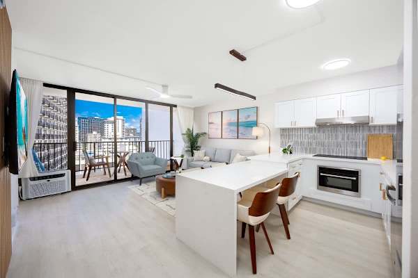 Unwind in this bright, open-concept living space with a modern kitchen, a breakfast bar, and a private lanai offering stunning views.