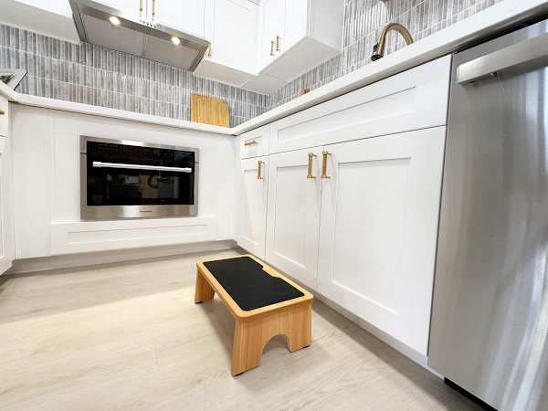 A thoughtful touch for families, this kitchen features a kid-friendly step stool, making it easy for little ones to lend a hand and feel right at home.