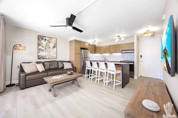 Relax in your open-concept living space where you can rest on the comfortable sofa, grab a quick bite at the kitchen's breakfast bar, or catch a show on the 55" Smart TV right as you walk in!
