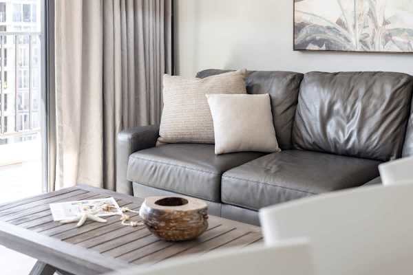 Relax and get comfortable on this inviting sofa, perfectly situated next to the balcony and featuring a coffee table for that perfect vacation feel!