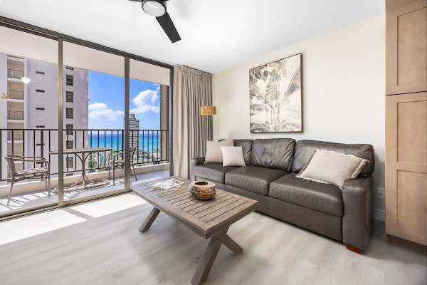 Step out onto your private balcony from this bright living area and enjoy those incredible ocean views, or relax inside on the comfy sofa after a day of exploring!