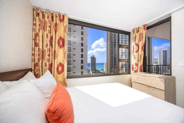 Wake up to a gorgeous view right from your bed! The large window in your bedroom frames the city buildings and gives you a peek at the beautiful blue ocean beyond!