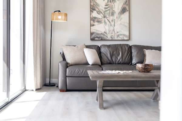 Relax and get comfortable on this inviting sofa, perfectly situated next to the balcony and featuring a coffee table for that perfect vacation feel!