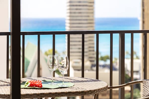 Step through the glass doors onto your private balcony, set up with a delightful bistro table and chairs, where you can sip your favorite drink and enjoy that beautiful view of the city and the sparkling ocean!