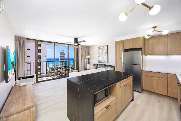 This open layout unit connects your fully-equipped kitchen to the inviting living area, allowing you to easily chat with your group while prepping meals, all while enjoying those beautiful ocean views right from the balcony!