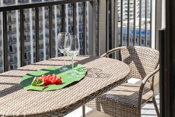 Imagine enjoying a lovely glass of wine out here! Your private balcony offers a charming table and chairs, ready for you to relax and savor a peaceful moment overlooking the city!