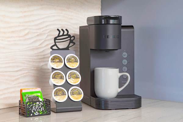 Start your day right with the convenient Keurig coffee maker, complete with a selection of complimentary delicious Hawaiian blend coffee pods and tea for your morning brew.