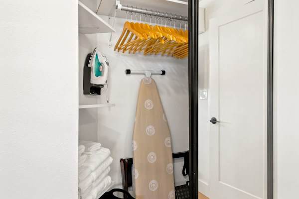 Stay organized and keep your wardrobe fresh with the in-unit closet amenities, including ample hangers, fresh towels, an iron, and an ironing board.