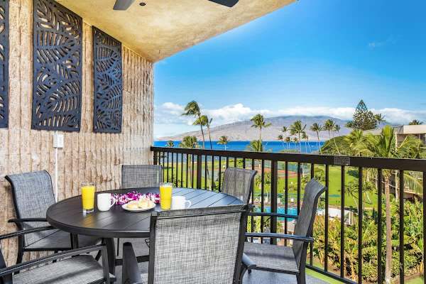 Enjoy your morning coffee or tropical breakfast with a breathtaking, expansive view of the ocean and neighboring island from your private, sun-drenched lanai.