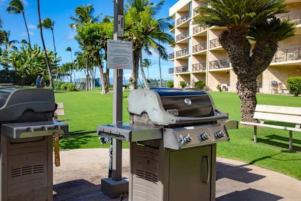 Enjoy a classic outdoor meal using the convenient resort gas grills, perfectly situated near the lush lawn and surrounded by tropical foliage.
