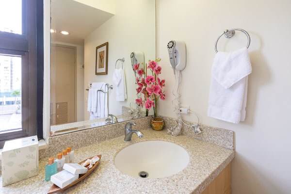 Bathroom with vanity and cabinet.