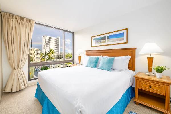 Master bedroom with King size bed, 2 night stands and black out curtains 