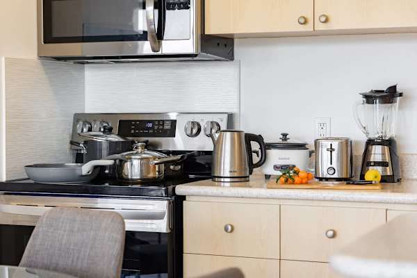 The fully-equipped kitchen has everything you need to whip up delicious meals, from a full-sized stove and oven to a rice cooker and blender.