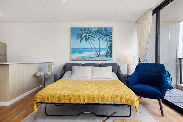 Transform the living area into a cozy sleeping space with a pull-out sleeper sofa, perfect for additional guests.