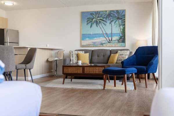 Relax and unwind in the open-concept living area that seamlessly connects the kitchen, dining, and living spaces.