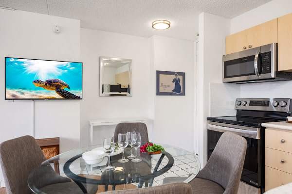 Enjoy dinner at the 4-person dining table with a view of the 42" smart TV, perfect for a relaxing night in.