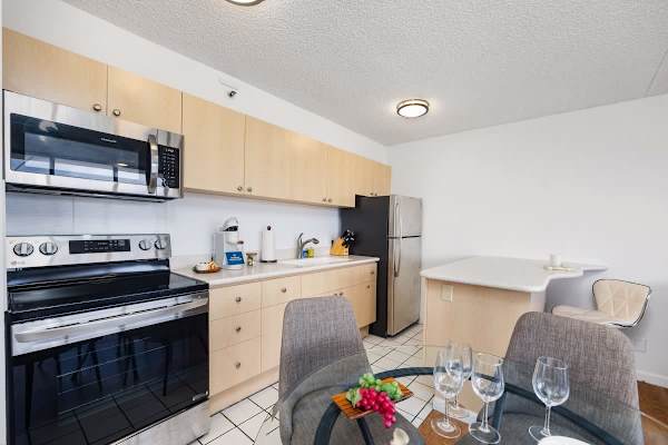 Enjoy the convenience of a fully-equipped kitchen with a full-sized stove and stainless steel appliances.
