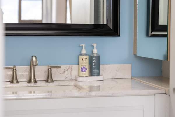 Stocked with complimentary hand soap, the bathroom vanity is a beautiful blend of style and convenience.