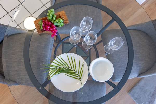 Enjoy your meals and drinks at the elegant 4-person glass dining table, creating the perfect setting for a memorable dining experience.